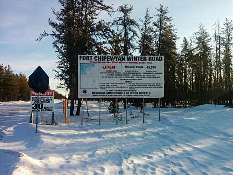 An image of the winter road sign for Fort Chipewyan - alberta winter road trips.
