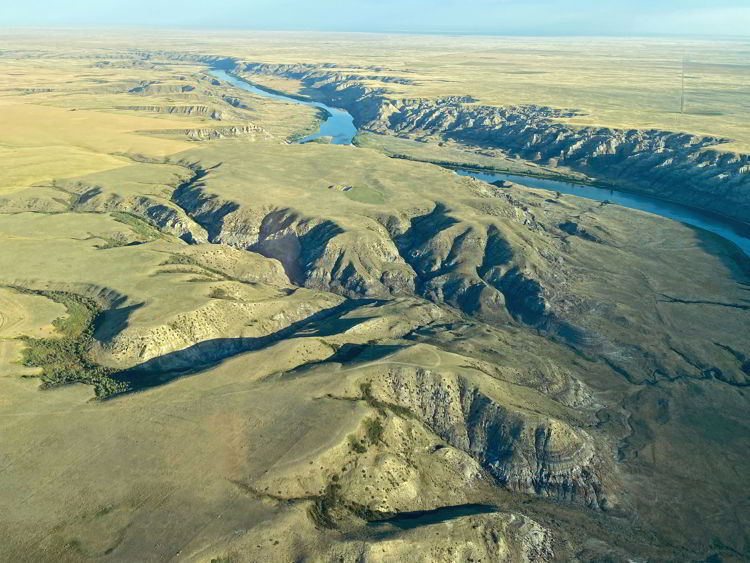 An image of an aerial view of the landscape surrounding Medicine Hat, Alberta, Canada taken on a flightseeing tour.  