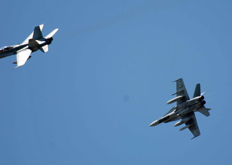 An image of planes flying in an airshow. 