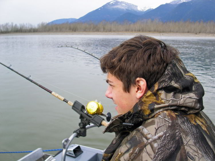 An image of a young man fishing. 