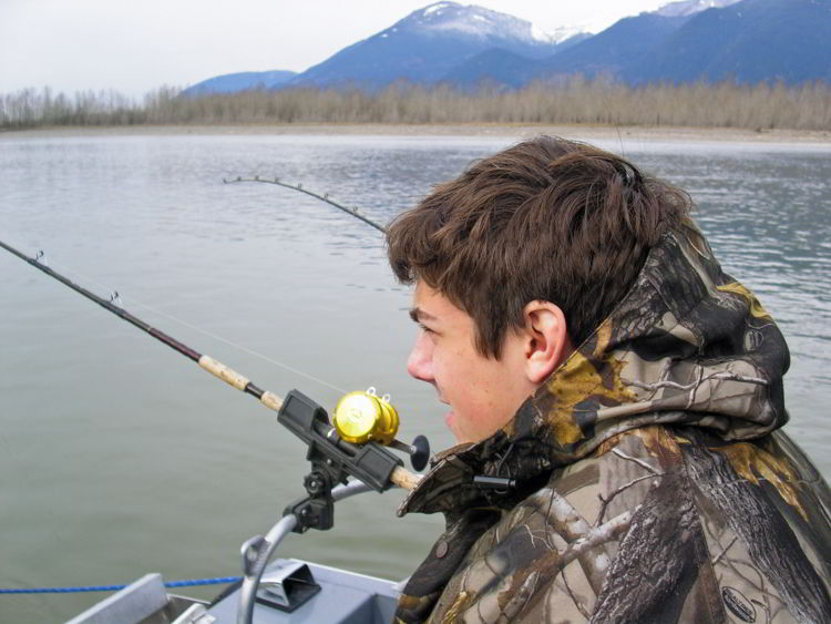 An image of a young man fishing.