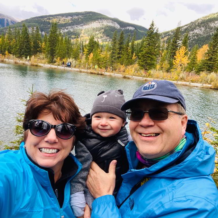 An image of a couple and a baby at Mount Lorette Ponds - Best easy hikes in Kananaskis, Alberta, Canada. 