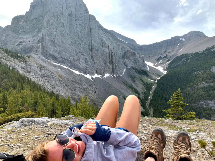 An image of two woman taking in the view on the Grassi Knob Trail in Kananaskis near Canmore, Alberta, Canada. 
