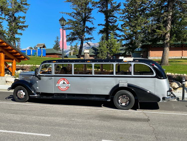 An image of the antique jammer bus owned by SunDog Tours in Jasper National Park, Alberta, Canada.