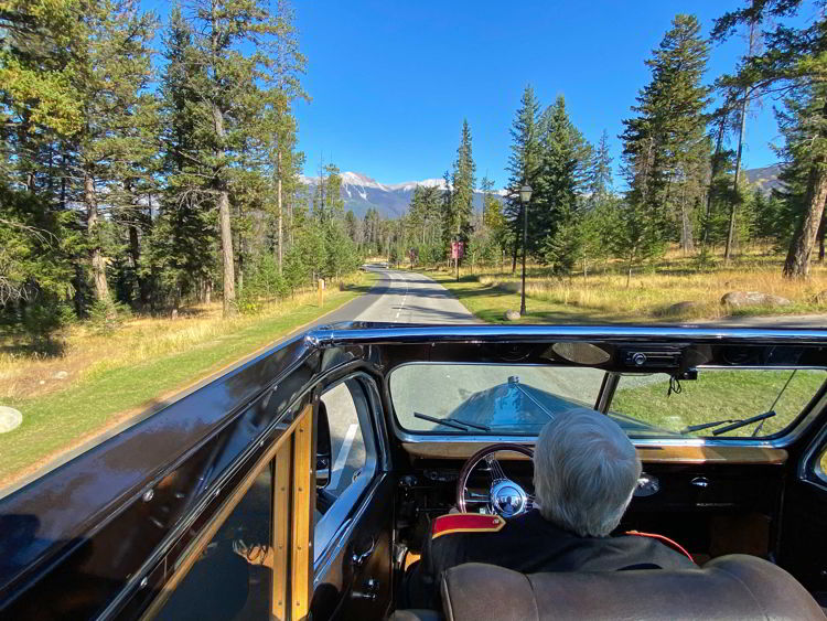 An image of a jammer bus tour in Jasper National Park in Alberta, Canada. 