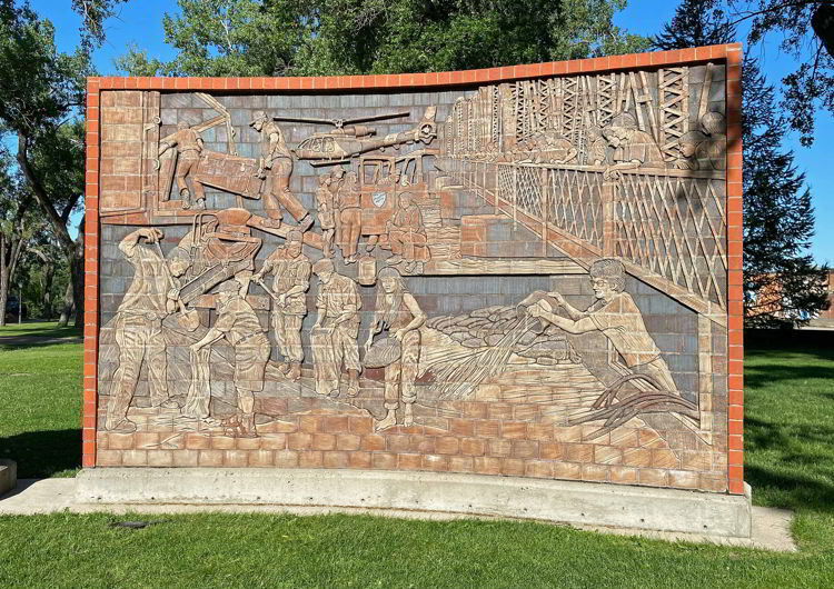 A historic stone mural depicting the 1995 flood in Medicine Hat, Alberta, Canada.