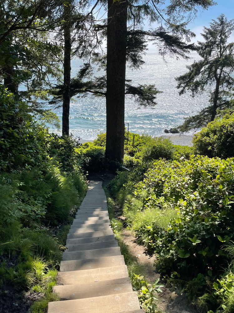 An image of a wooden staircase leading to Mystic Beach, Vancouver Island in British Columbia, Canada.