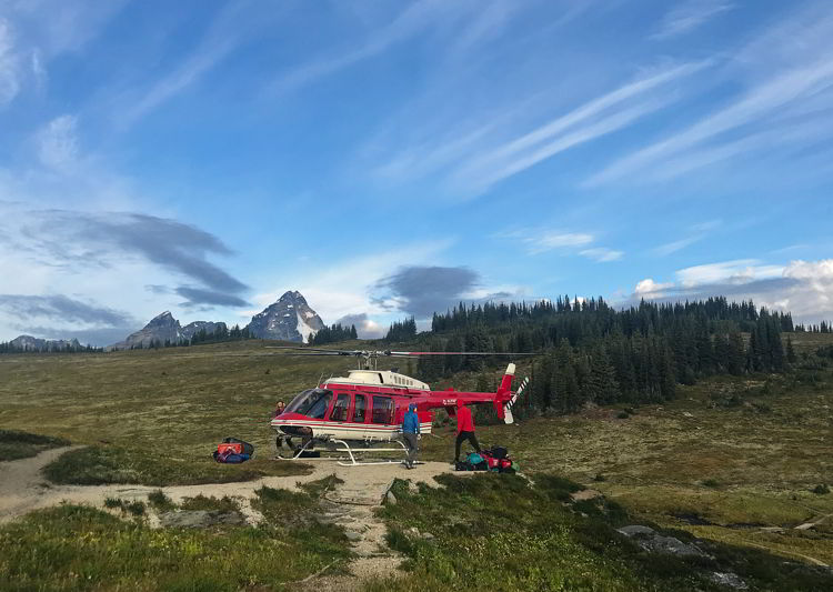 An image of a helicopter outside Purcell Mountain Lodge in British Columbia, Canada. 