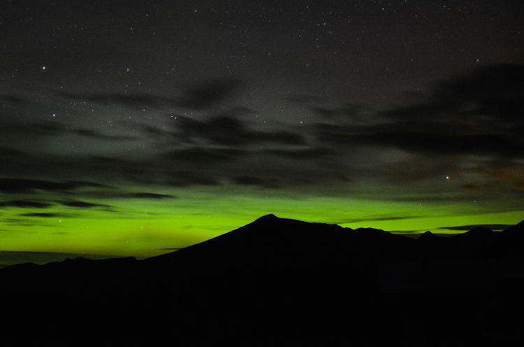 An image of the northern lights in the Purcell Mountains in British Columbia, Canada.