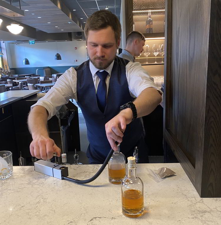 An image of a smoked old fashioned drink at Brazen restaurant in Banff, Alberta, Canada. 