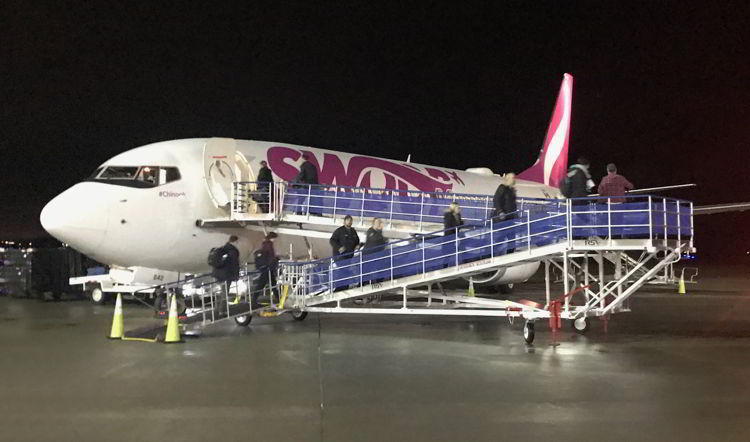 n image of people boarding a Swoop aircraft at Abbotsford airport - Swoop Airlines review