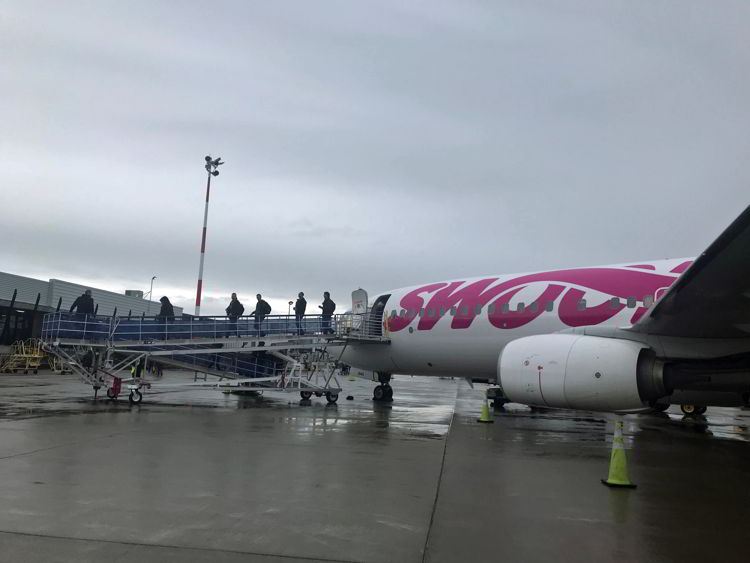 An image of people coming off a Swoop aircraft - Swoop Airlines review