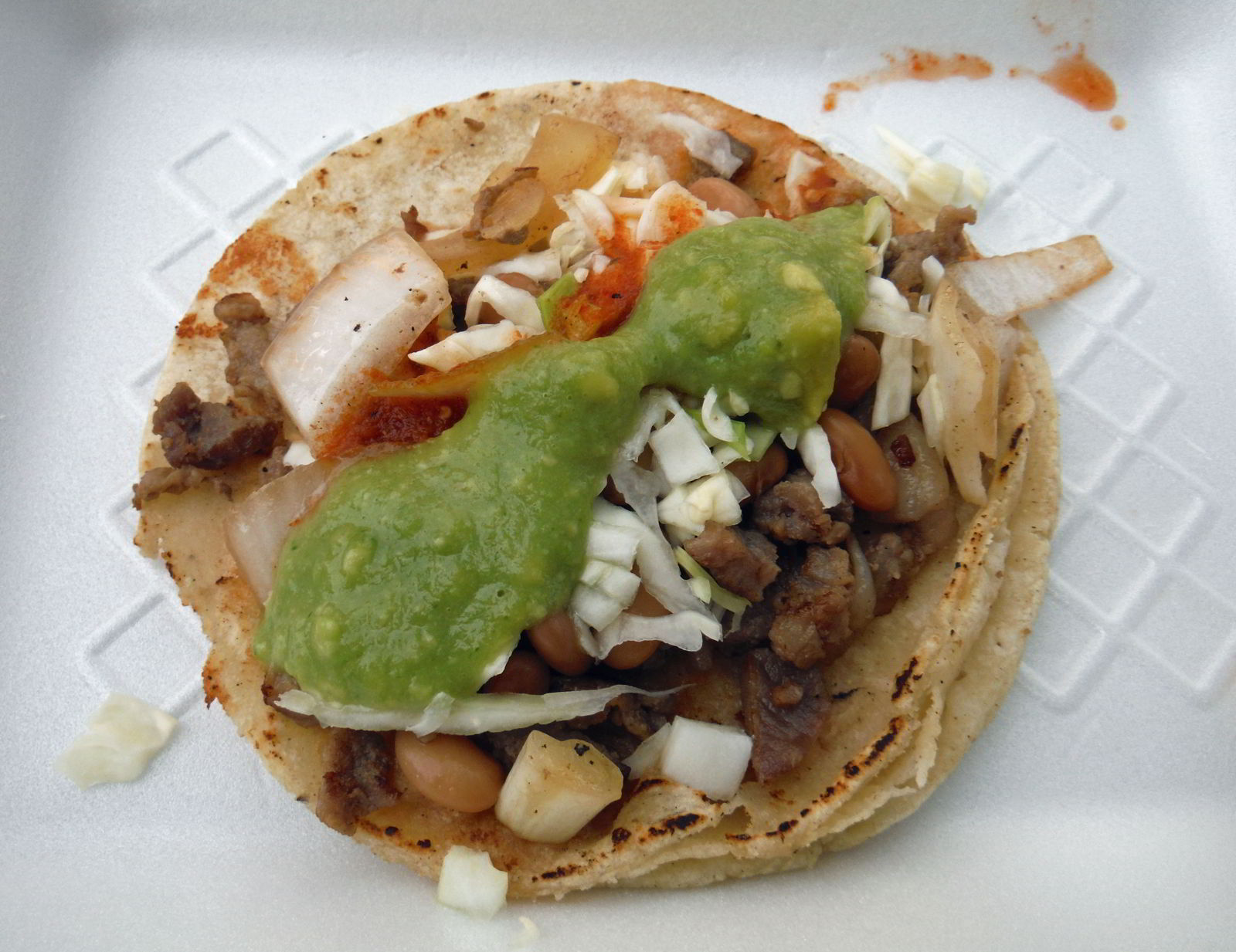 An image of a traditional taco from a taco stand called Taqueria El Cunado in Puerto Vallarta, Mexico - the best tacos in Puerto Vallarta