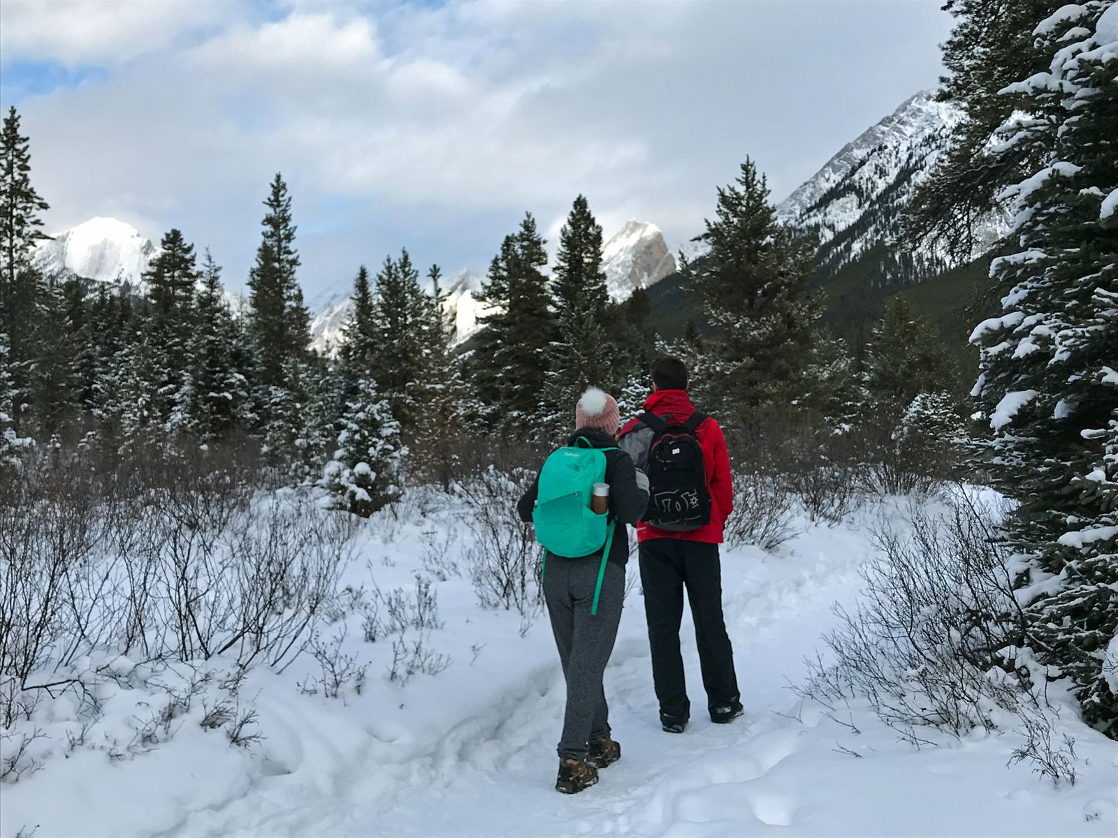 An image of two people hiking along the trail to the ink pots in Banff National Park - Microspikes for Hiking review