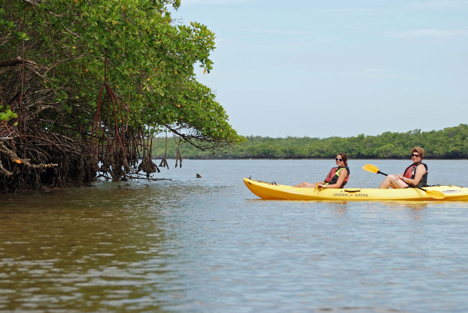 An image of two women in kayak in the Florida Everglades, USA.