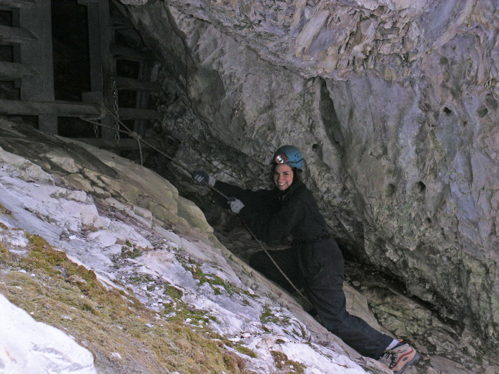 An image of a woman entering the Rat's Nest Cave in Canmore, Alberta