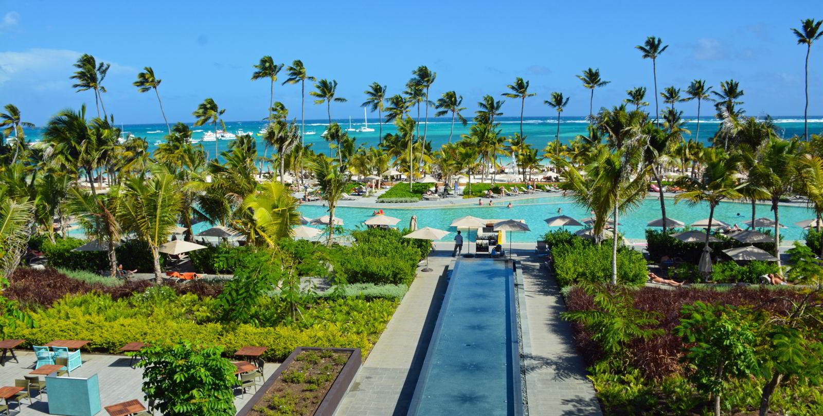An image of Lopesan Costa Bavaro Resort in Punta Cana taken from above the main pool looking out to the ocean.