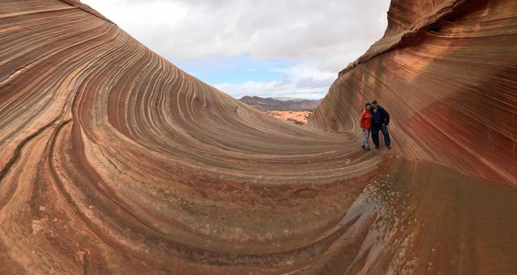 An image of a couple standing at The Wave in Arizona, USA. 