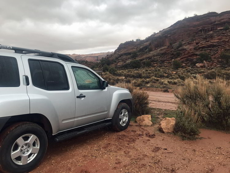 An image of a car at the parking lot ear the trailhead for the wave hike in Arizona, USA. 