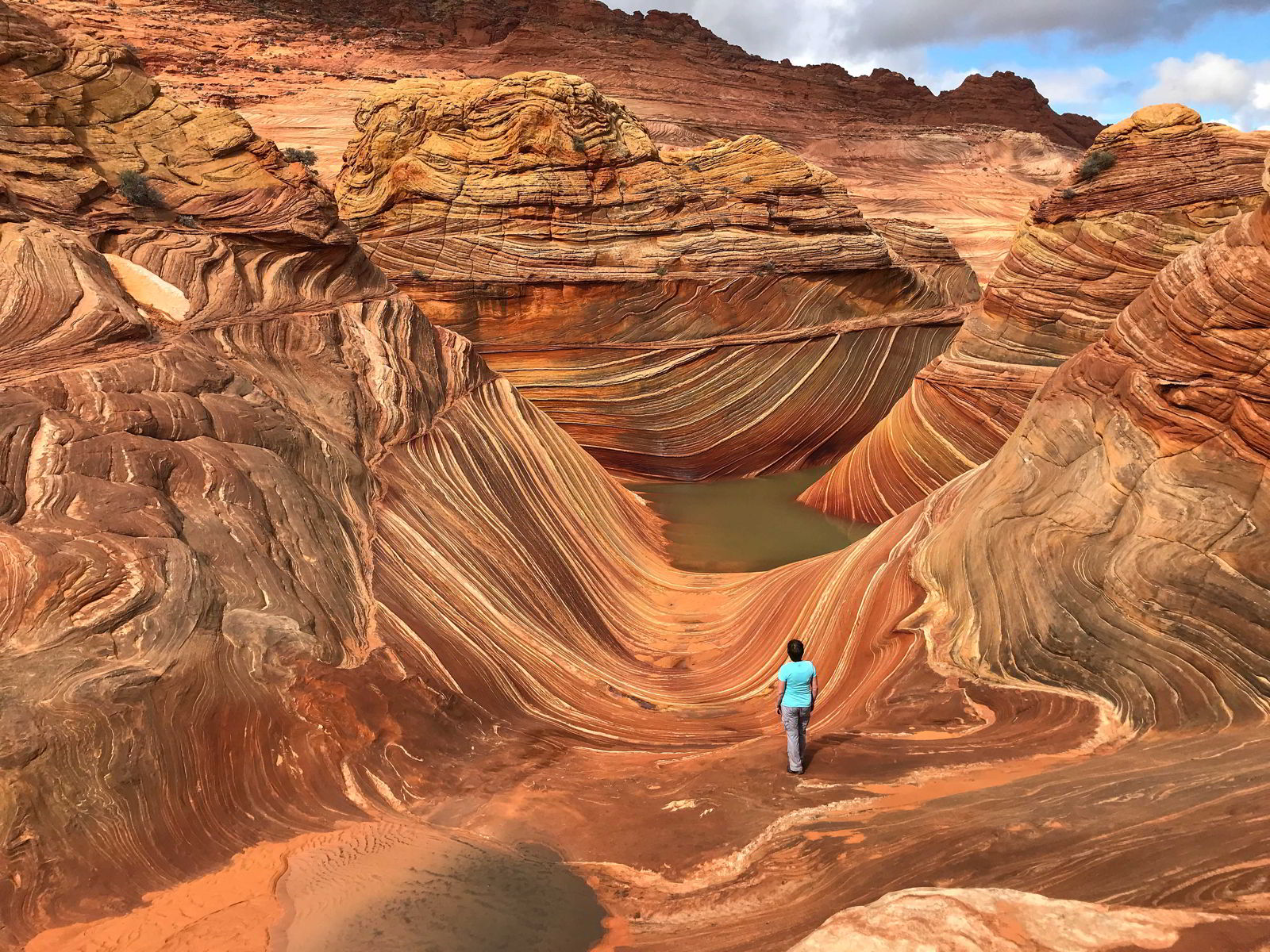 An image of a woman hiking the wave in Arizona, USA.