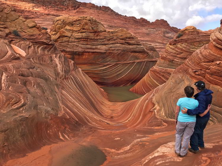 An image of a couple hiking the wave in Arizona, USA. 