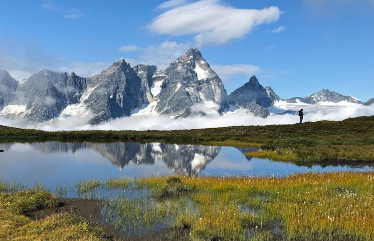 An image of a hiker in the Purcell Mountains near Purcell Mountain Lodge in British Columbia, Canada.