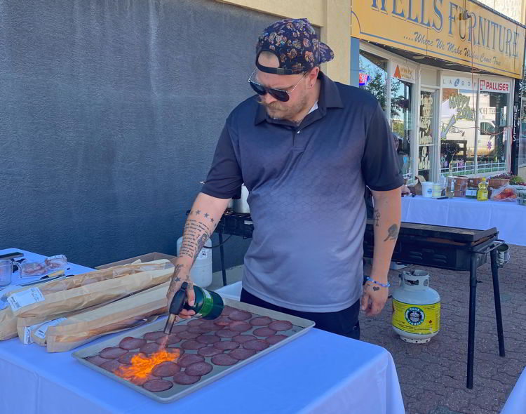 An image of Chef Tyson Wright at the Taste of the Heartland long table dinner in Stettler. 