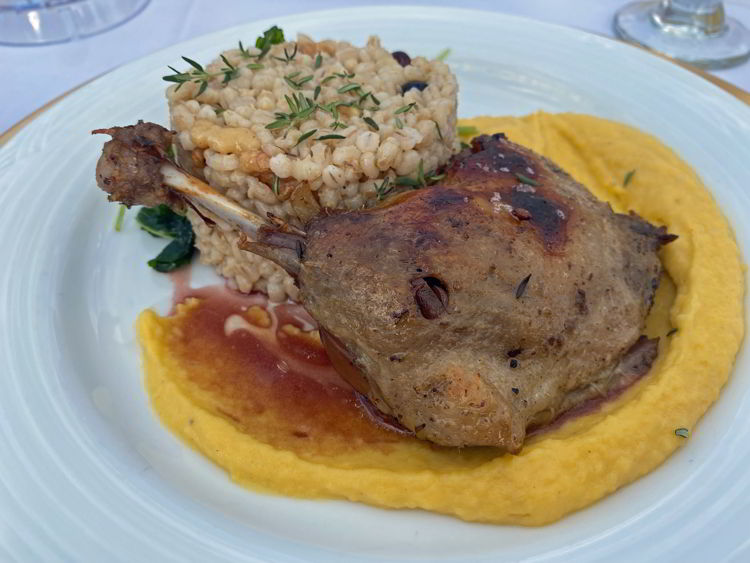 an image of duck confit for the main course at the Taste of the Heartland long table dinner in Stettler, Alberta. 