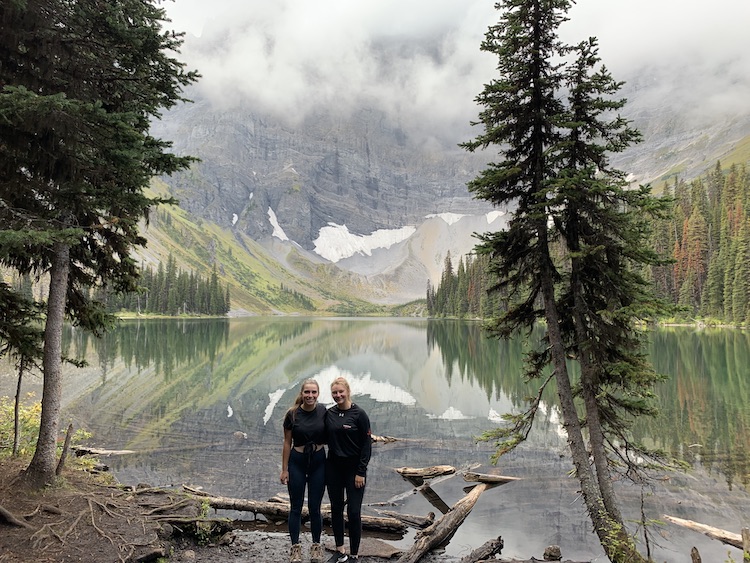 Two girls standing near Rawson Lake.