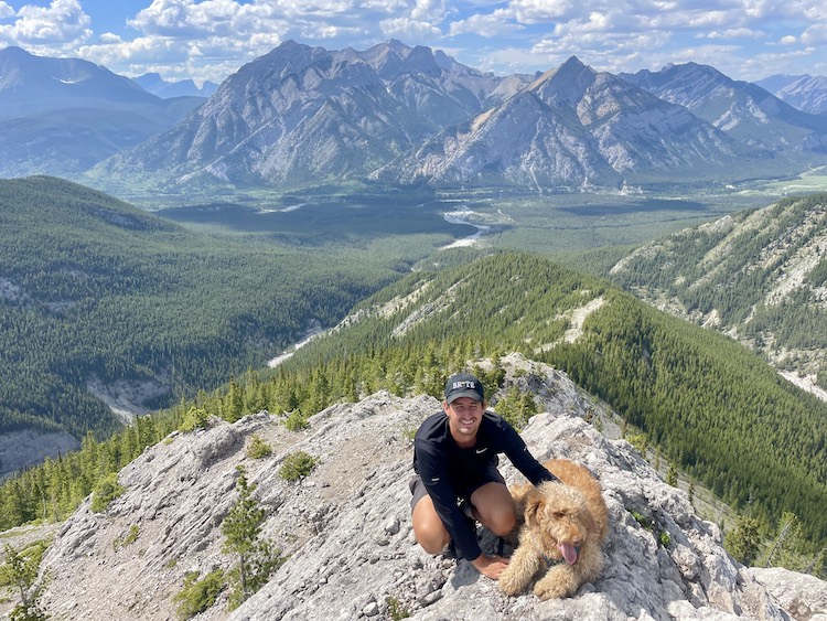 A man and a dog at the top of Porcupine Ridge.