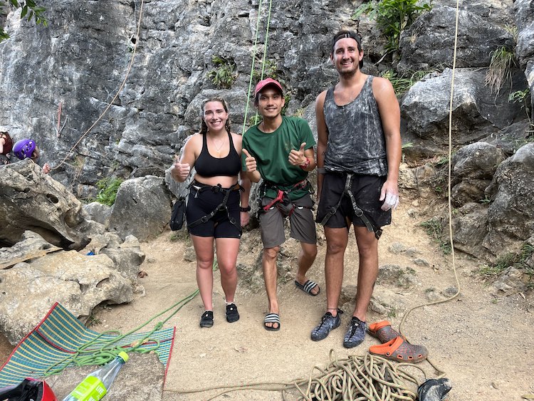 A couple with a rock climbing instructor.