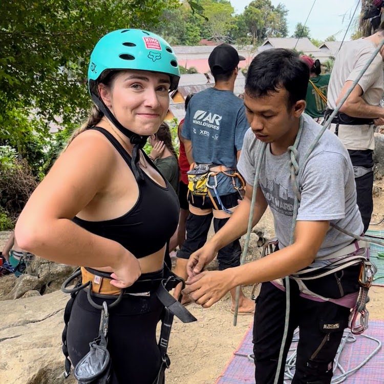 A woman making a nervous face before rock climbing in Krabi.