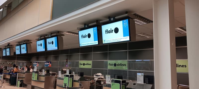 An image of the Flair Airlines check in area at the airport - Flair Airlines review.
