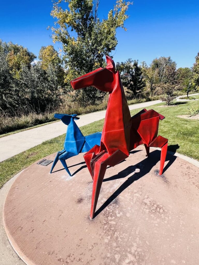 An image of Red and Blue Pony sculpture, by Kevin Box at the Benson Sculpture Park in Loveland, Colorado. 