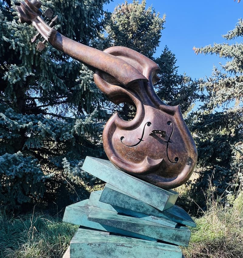 An image of the Stock Market sculpture by Philippe Guillerm. at the Benson Sculpture Garden in Loveland, Colorado.   
