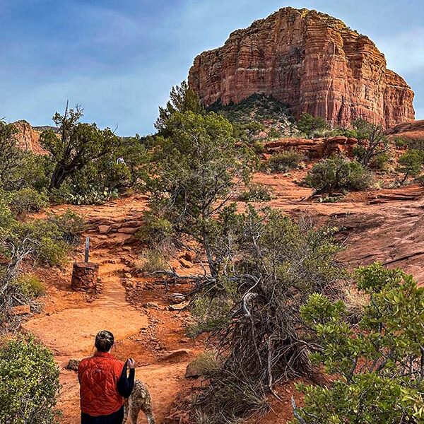 a girl hiking near cathedral roc in sedona, arizona.