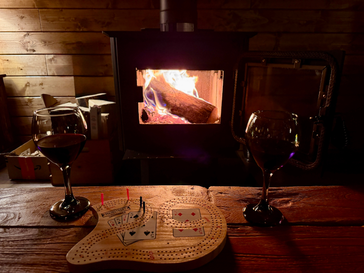 wine glasses and wood burning fire at river retreat kananaskis