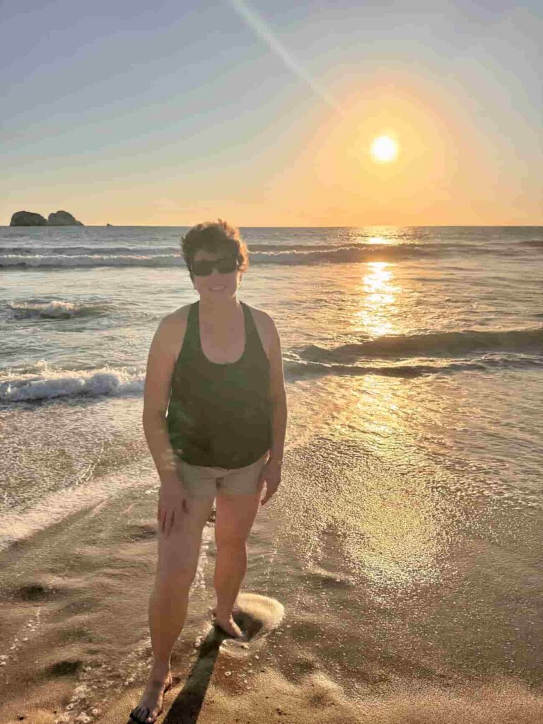 An image of a woman standing on the beach in Mazatlan, Mexico. 