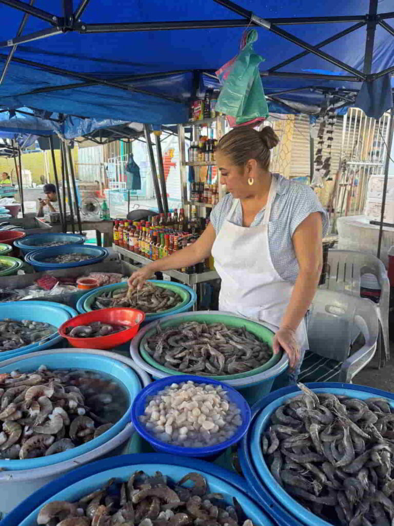 An image of a shrimp vendor at the fish market in Mazatlan, Mexico. 